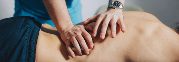 A person getting a back massage.